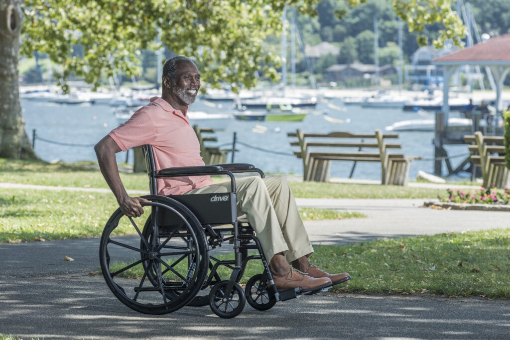 Man sitting in wheelchair outside