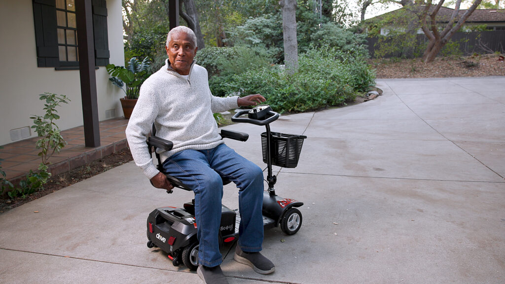 Man sitting on Mobility Scooter