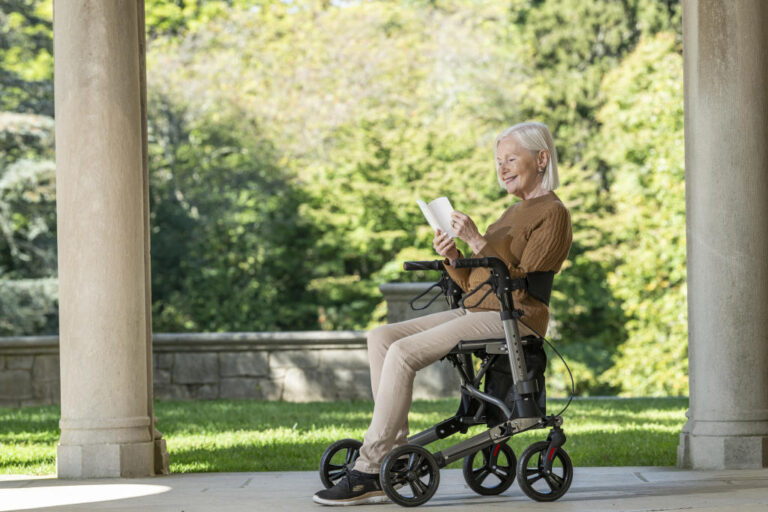 Woman Reading while sitting in Walker